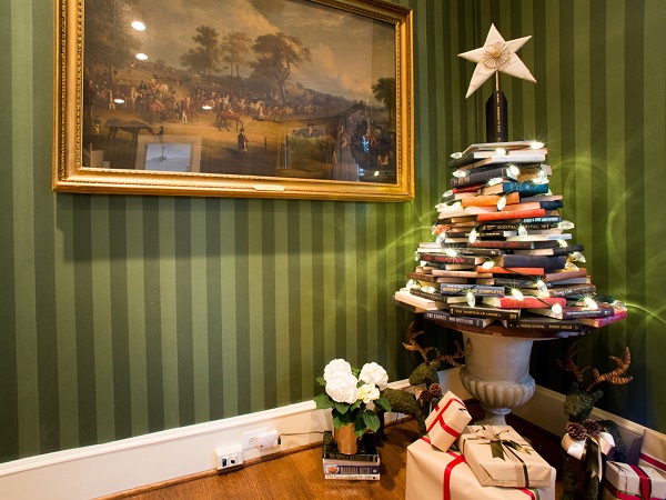 As seen on HGTV’s White House Christmas 2013, books are stacked in the shape of a Christmas tree in the Library of the Vice President’s home. A repurposed star, made out of the pages of old books, is held up by the book Promises To Keep, written by Vice President Joe Biden, and beneath it is a book by Dr. Jill Biden, Don't Forget, God Bless Our Troops.